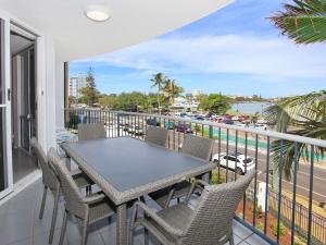 a balcony with a table and chairs and a view of the water at Broadwater Quays 5 in Mooloolaba