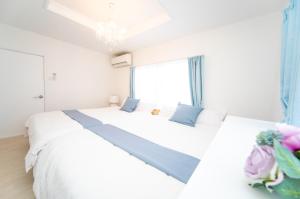 Postel nebo postele na pokoji v ubytování Awaji Central Villa in Shizuki1764 + 36 fotografií
