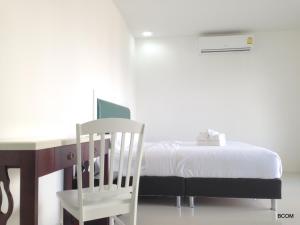 Ένα ή περισσότερα κρεβάτια σε δωμάτιο στο Khun Chaweng Resort