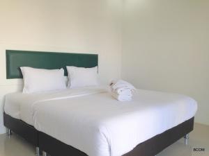 Ένα ή περισσότερα κρεβάτια σε δωμάτιο στο Khun Chaweng Resort