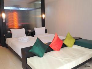 Ένα ή περισσότερα κρεβάτια σε δωμάτιο στο Khun Chaweng Resort