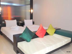 Ένα ή περισσότερα κρεβάτια σε δωμάτιο στο Khun Chaweng Resort