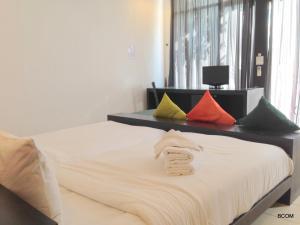Ένα ή περισσότερα κρεβάτια σε δωμάτιο στο Khun Chaweng Resort