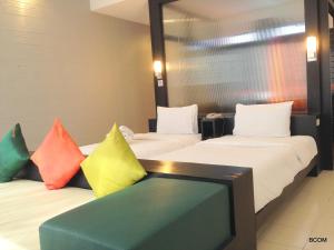 Ένα ή περισσότερα κρεβάτια σε δωμάτιο στο Khun Chaweng Resort
