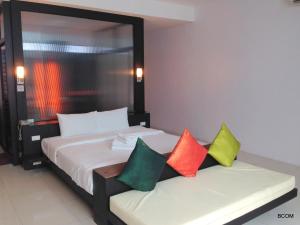 Ένα ή περισσότερα κρεβάτια σε δωμάτιο στο Khun Chaweng Resort
