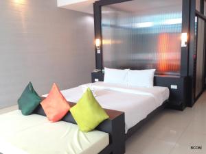 Ένα ή περισσότερα κρεβάτια σε δωμάτιο στο Khun Chaweng Resort