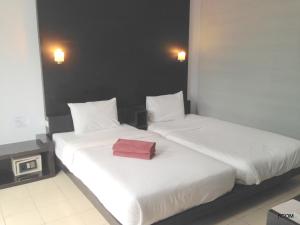 Ένα ή περισσότερα κρεβάτια σε δωμάτιο στο Khun Chaweng Resort