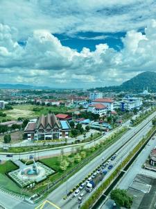 a city with a highway and cars on the road at Summit Signature Hotel Batu Pahat in Batu Pahat