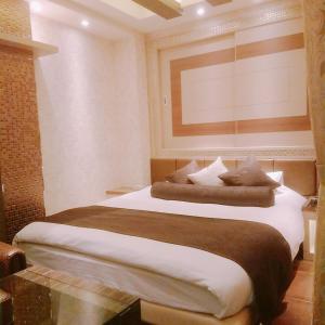 Giường trong phòng chung tại Hotel Lei