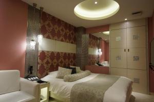 Giường trong phòng chung tại Hotel Lei