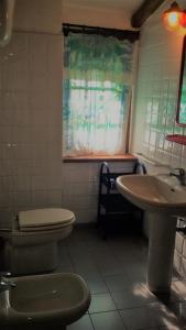 a bathroom with a toilet and a sink at Appartamenti Salato in Tropea