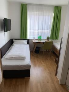 Postel nebo postele na pokoji v ubytování A3 Hotel