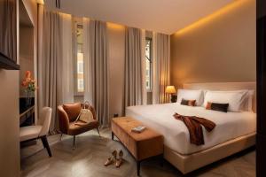 Un pat sau paturi într-o cameră la Hotel La Place Roma