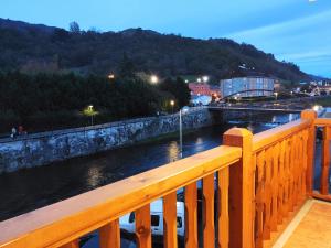 a view of a river from a bridge at Apartamentos tiu Enrique 4 Piso in Cangas de Onís