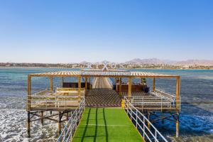 a pier in the middle of the water at Rixos Premium Seagate - Ultra All Inclusive in Sharm El Sheikh