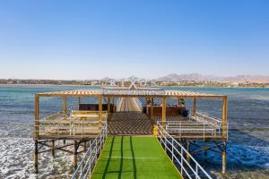 a pier in the middle of the water at Rixos Premium Seagate in Sharm El Sheikh