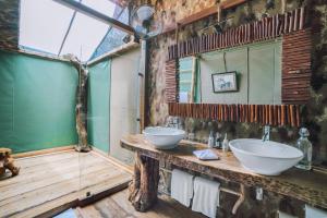 
a bathroom with a sink and a counter top at Leopard Safaris Yala by KK Collection in Yala
