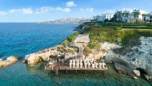 an island with a wedding set up on the water at Xanadu Island in Akyarlar