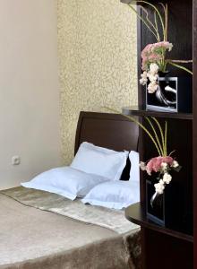 מיטה או מיטות בחדר ב-Parvana Hotel