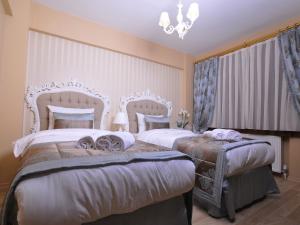 Postel nebo postele na pokoji v ubytování Divani Ali Hotel