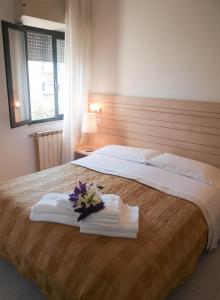 Ein Bett oder Betten in einem Zimmer der Unterkunft Residence Internazionale