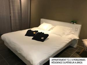 Postel nebo postele na pokoji v ubytování Coin d'Aubrac Hôtel Restaurant SPA de luxe