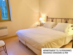 Postel nebo postele na pokoji v ubytování Coin d'Aubrac Hôtel Restaurant SPA de luxe