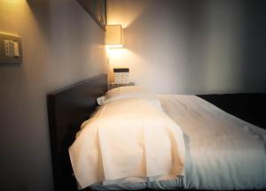 Postel nebo postele na pokoji v ubytování Residence San Marino