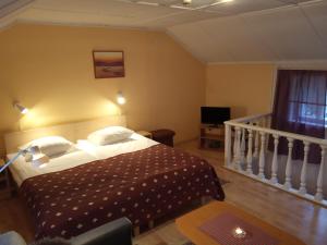 Postelja oz. postelje v sobi nastanitve Repo Hotel