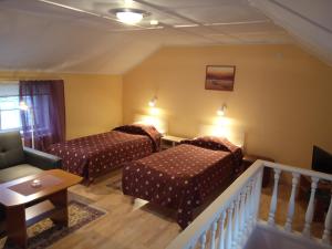Postelja oz. postelje v sobi nastanitve Repo Hotel