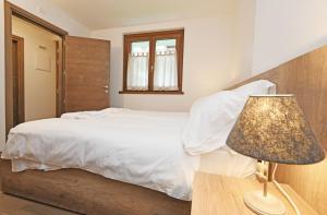 Postel nebo postele na pokoji v ubytování Ai Suma Residence