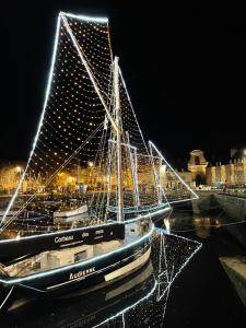 a boat is docked in a marina at night at Vannes Lodge in Vannes
