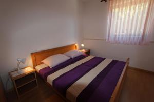 Postel nebo postele na pokoji v ubytování Apartments Miko