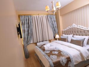 Postel nebo postele na pokoji v ubytování Divani Ali Hotel