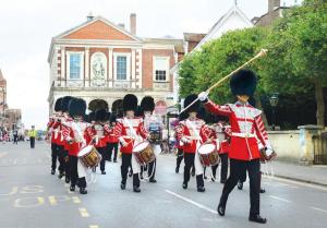 a group of marching band in a parade down a street at 4 Bed 3 Baths in CENTRAL WINDSOR! WALK 2 ALL THE SIGHTS! LEGOLAND 5 MIN DRIVE in Windsor
