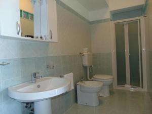 a bathroom with a toilet and a sink at Tus'Hotel in Castel di Tusa