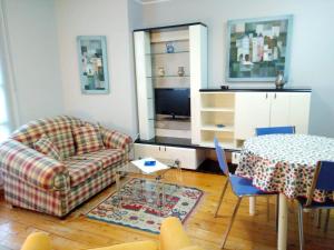 a living room with a couch and a table at 2 bedrooms apartement at Llanes 200 m away from the beach with wifi in Llanes