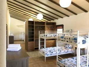 Posteľ alebo postele v izbe v ubytovaní Spacious villa in Can Trabal with private pool and jacuzzi 980 m²