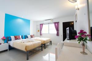 Postel nebo postele na pokoji v ubytování Noble House Chiangmai + 37 fotografií