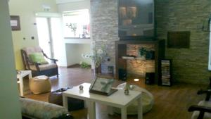 a living room with a couch and a table at Charming House in Santa Eulalia, perfect for 18 guests in Santa Eulália