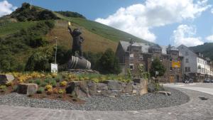 a statue of a person standing on top of a hill at Mosel Panorama in Zell an der Mosel