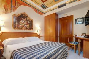 Cama ou camas em um quarto em Hotel Amalfi