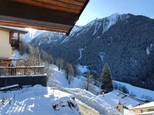 a view of a snowy mountain from a house at Chalet de 3 chambres a Peisey Nancroix a 500 m des pistes avec terrasse et wifi in Peisey-Nancroix