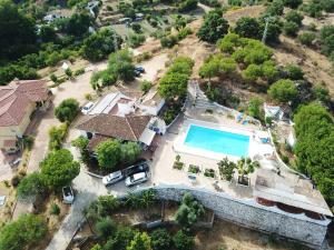 an aerial view of a house with a swimming pool at 4 bedrooms villa with sea view private pool and furnished garden at Mijas 6 km away from the beach in Mijas