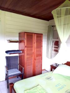 Cama ou camas em um quarto em Appartement d'une chambre avec jardin clos et wifi a Le Vauclin a 5 km de la plage