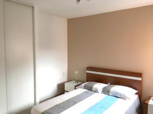 a bedroom with a bed and a large window at Appartement de 2 chambres avec terrasse et wifi a Bagnolet in Bagnolet