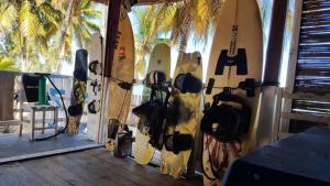 a bunch of surfboards are lined up against a wall at 4 bedrooms house with enclosed garden and wifi at Ifaty in Ifaty