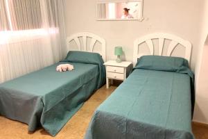 מיטה או מיטות בחדר ב-3 bedrooms house with shared pool terrace and wifi at Antigua