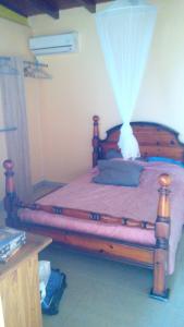 Cama o camas de una habitación en Maison de 3 chambres avec wifi a Petit Bourg a 2 km de la plage