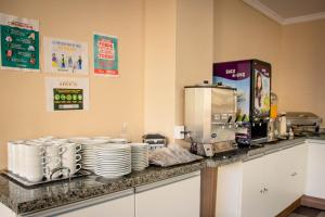 Kuchyň nebo kuchyňský kout v ubytování Hotel Letto Caxias